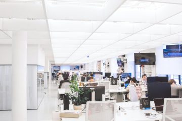 pexels-photo-3778619-3778619 Spacious and well-lit office interior with modern furniture and workstations, ideal for a dynamic work environment.
